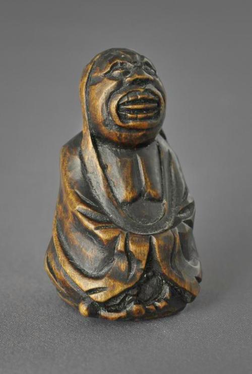 Netsuke of a Daruma with a Rosary